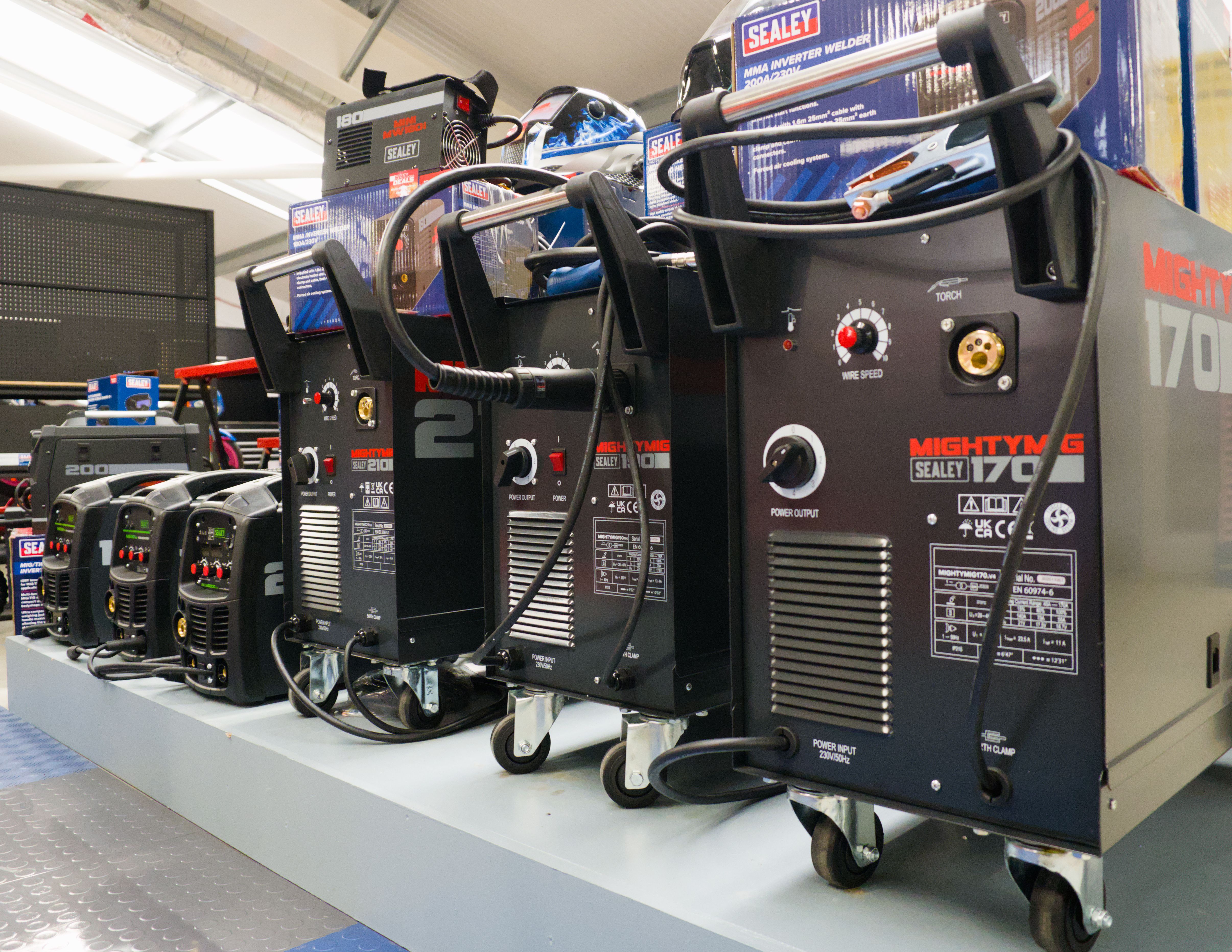 a showroom, featuring an open socket set and many other tools.