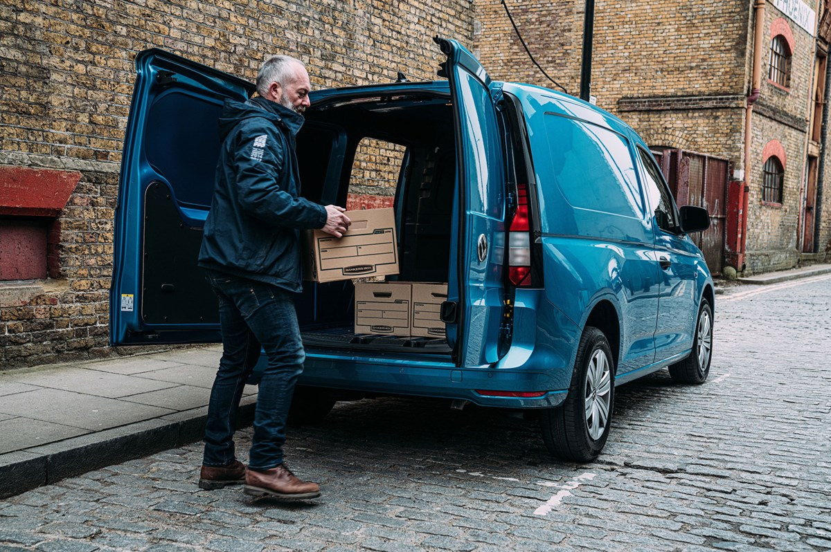 Person loading box into van